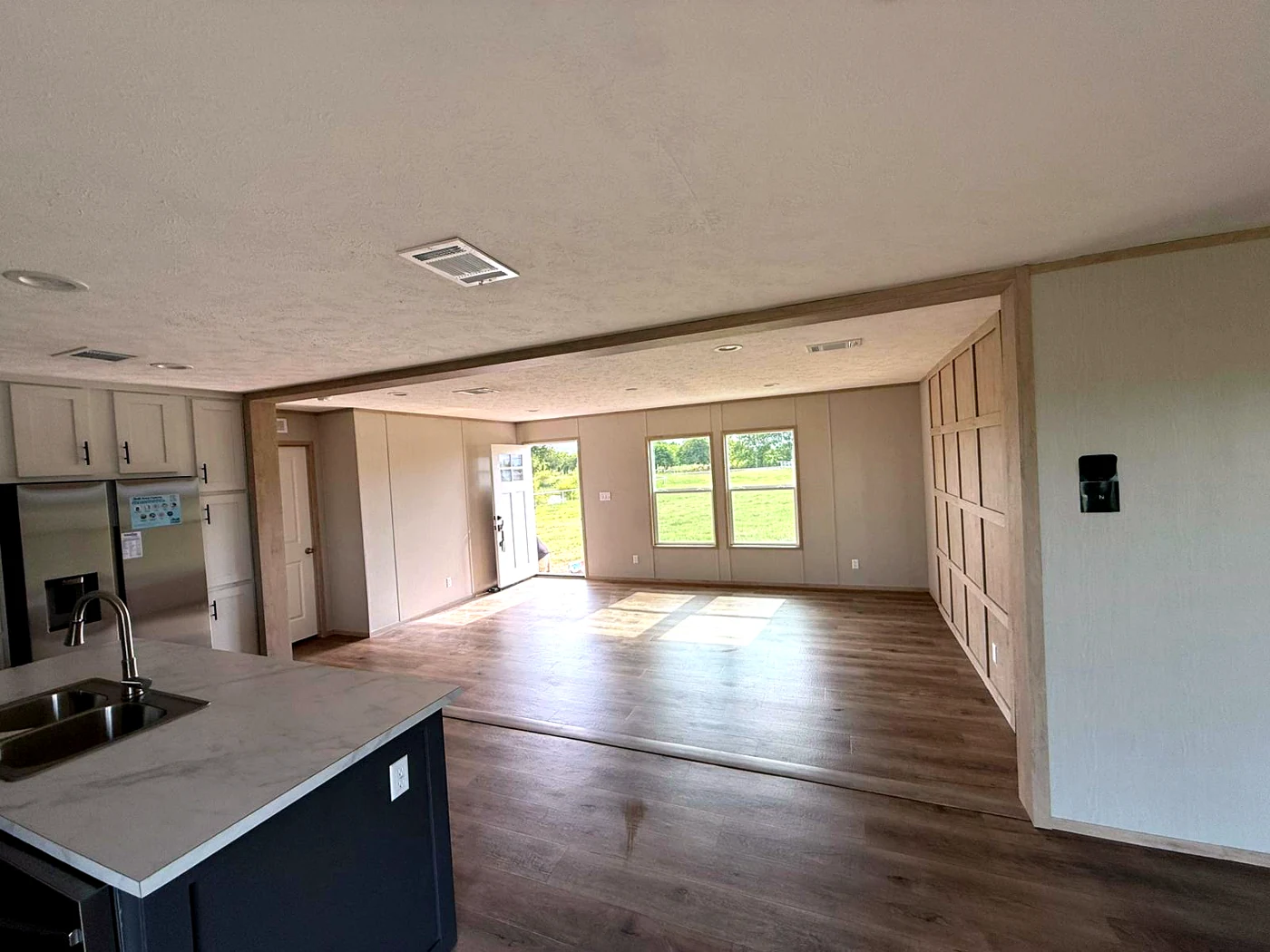 Open-concept kitchen and living area by Tidy Up